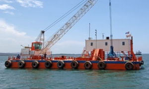 Coral Cinco clamshell dredger